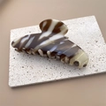 Detailed close-up of brown marble acetate hair claw clip with golden Barrette La France text - Beige Coffee
