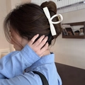 Elegant white marble pattern bow hair claw clip for bun styling on female model - Off-White Bar Clip