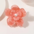 Close-up of pink marble acetate flower hair claw with a white pearl center detail - Marbled Pink (Style E 7cm)