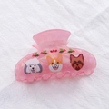 Close-up of pink marbled hair claw clip with cute cartoon dog patterns and holly berries - Pink Dog Style (Style A)