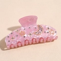 Primer plano de la pinza para el pelo rosa jaspeado con estrellas y lunas de cristal - 9.5CM / Rosa