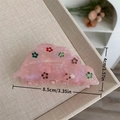 Detail view of pink acetate hair claw with rhinestones measuring 8.5cm by 4cm - Pink Leaf Hair Claw
