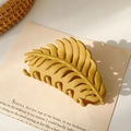 Detailed macro view of matte ginger leaf hair claw clip on beige decorative background - Matte Ginger Yellow (9.5cm)