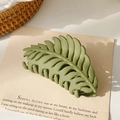 Macro shot of matte green leaf hair claw clip with detailed vein textures on retro card - Matte Army Green (9.5cm)