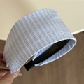 Close-up of light blue striped seersucker headband with wave texture and wide band - Blue Striped Headband