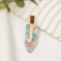 Elegant gold metal hair clip with mint and orange marble acetate design on a wave board - Sky Blue