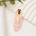 Pink marble acetate hair clip with golden metal base on a white textured board - Rose Pink