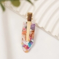 Dettaglio del fermaglio per capelli in acetato colorato con motivo floreale e oro - Arcobaleno