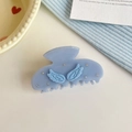 Detail view of light blue acetate hair claw with wing design and sparkling rhinestones - Blue Wing Claw Clip