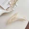 Detail of dolphin hair claw clip in pearl white finish with glossy pearlescent texture - 2# Creamy White Dolphin 13cm