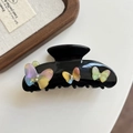 Dettaglio della molletta nera in acetato con farfalla 3D iridescente e piccoli strass - Arancione Iridescente (1#炫彩橘7.5cm)