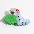 Detail of creative caterpillar hair claw clip with marble texture and spring mechanism - White Blue Silkworm