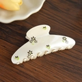 Close-up of a cream-colored floral hair claw clip on a rustic wooden background - 10.1cm / White