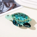 Detailansicht der Schildkröten-Haarklammer aus marmoriertem blau-grünem Acetat-Material - Hellgrüne Schildkröte