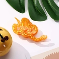 Vista dettagliata di una pinza per capelli a forma di serpente arancione con macchie - 10.3cm / Arancione