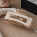 Macro detail of a cream rectangular hair claw clip with firm grip teeth on wooden background - 10.5cm / Light Khaki