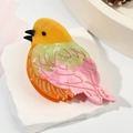 Cute acetate bird hair claw clip in colorful patchwork design on a stone stand - Pink 10.2cm