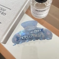 Detailed view of a light blue pearlescent shark hair clip with fish patterns and texture - 5# Blue Little Fish Style
