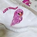 Detailed view of pink mermaid hair claw clip with heart motif on a white shell tray - Pink Heart Big Eye Mermaid Claw