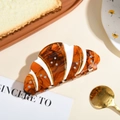 Pinza per capelli a forma di croissant ambrato con strass e trama di pane - Croissant / 10cm