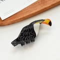 Süße Haarklammer im Tukan-Design mit schwarzem Körper und leuchtend orangefarbenem Schnabel - 10.2cm / Schwarzer Papagei