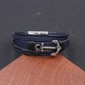 Mens multilayer leather bracelet with silver anchor charm on a wood display stand - Navy Blue Magnetic Anchor