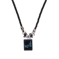 Close-up of a woven cord necklace featuring a Capricorn zodiac sign rectangular pendant - Capricorn