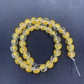 Detailed view of yellow crystal beads with golden engraved Chinese luck characters - 10mm / White Wealth God Style (MS-0029-白财神)