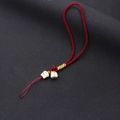 Detail of burgundy hand-woven lanyard with two white Lucky Cat charms and yellow accents - Wristlet Style / Burgundy