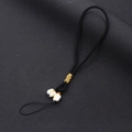 Detailed shot of black braided phone strap featuring two cute white ceramic lucky cat beads - Wristlet Style / Black