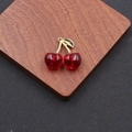 Minimalist red cherry pendant with golden leaf and acrylic beads on wooden display - Gold Tone Dark Red (DIY-067)