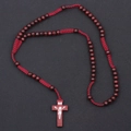 Detailed close-up of 8mm red wood prayer beads and cross pendant on black background - Burgundy