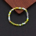 Bracciale elastico bohémien con perline di cristallo sfaccettate e vetro colorato - Serie Gialla