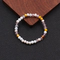 Bracciale bohémien fatto a mano con perle di cristallo colorate e sfaccettate in vetro - Serie Arancione