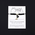 Handwoven heart magnet couple bracelets in black and white on elegant display card - White Black Rope Black Steel Magnetic Heart