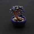 Detail of handcrafted blue crystal tree with copper wire branches in ceramic pot - Natural Lapis Lazuli Tree
