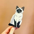 Detailed close-up of a handcrafted Siamese cat acetate hair claw clip held in hand - Black Beige