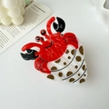 Detail of hermit crab hair claw clip made of glossy acetate in red and white shell - White Coffee