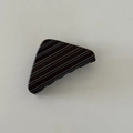 Detail of a minimalist triangular hair claw clip with black and white horizontal stripes - Triangle Shaped Style (D191)