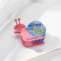 Pink and blue snail-shaped hair claw clip with colorful acetate pattern and rhinestones - Sapphire Blue