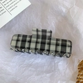 Macro shot of large black and white checkered acetate hair claw clip for thick hair - 10cm / Black Plaid