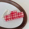 Detail of red and white checkered hair claw clip on a minimalist beige tray - 10cm / Red Plaid