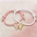 Pulseras de pareja de mariposa tejidas en rosa y blanco con dije de corazón magnético - Rosa y Blanco