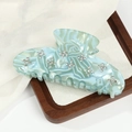Elegante pinza per capelli in acetato marmorizzato azzurro con motivi di fiori di cristallo - Azzurro