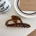 Macro shot of large tortoiseshell acetate hair claw clip with stable gripping teeth - Amber 11.5cm