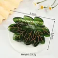 Pinza per capelli a foglia verde con venature dorate su base bianca 9.6cm - Pinza a Foglia Verde a Nove Petali