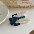 Detailed macro shot of a blue and white cicada hair claw clip made of premium acetate - Cicada (9.5cm)