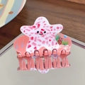 Détail du clip à cheveux étoile de mer rose montrant le motif océan en acétate et les dents - Étoile de mer