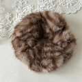 Detailed macro view of the fluffy brown zebra pattern plush scrunchie on lace background - Coffee Zebra Pattern (5974862436716)
