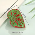 Leaf shaped hair claw clip in green and red resin showing 8.8cm length and 30.2g weight - Red Spots